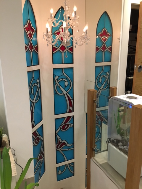 Glass panels with chandelier and mirror